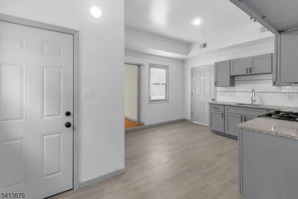 a view of a kitchen with electric appliances