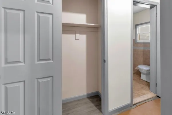 a view of a bathroom from a hallway
