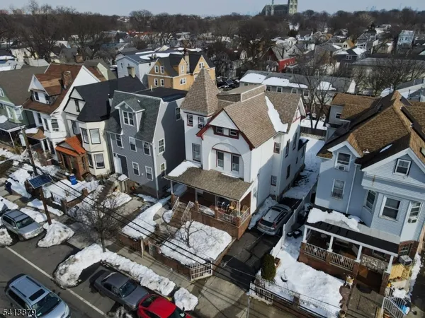 an aerial view of a house with seating space