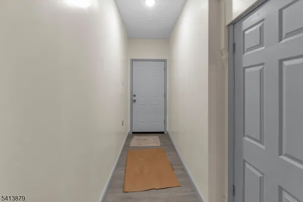 a view of a hallway with a white door