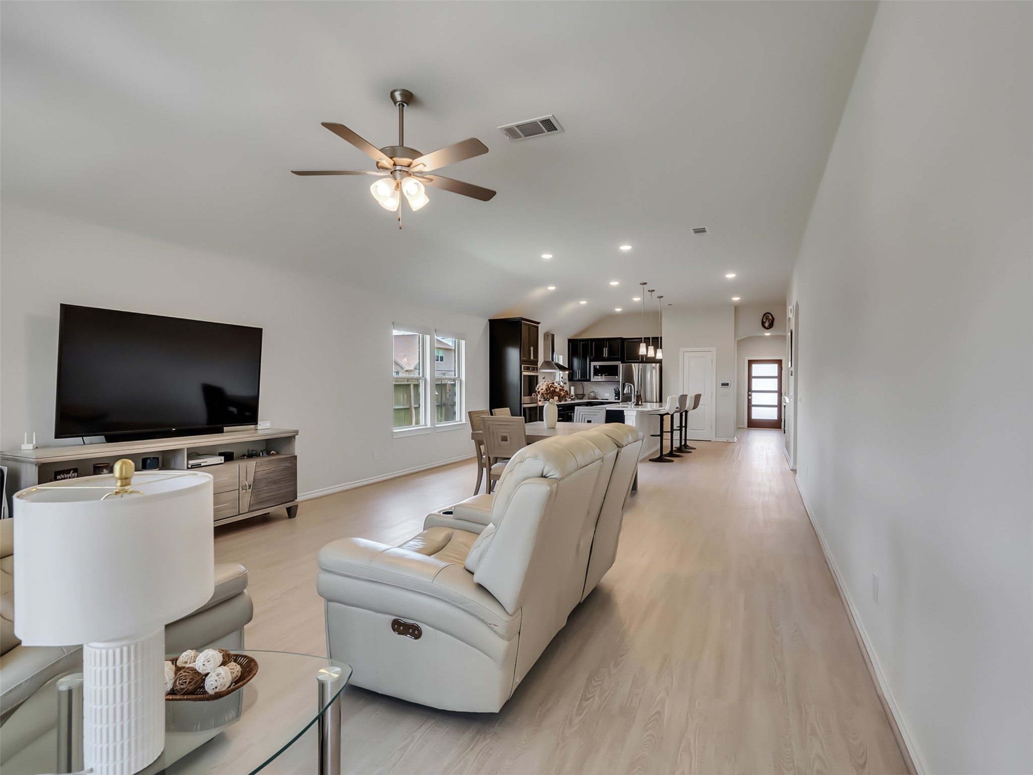 27997 Lone Hollow Lane Spring, TX 77386 - Photo 31 of 45 a living room with furniture and a flat screen tv