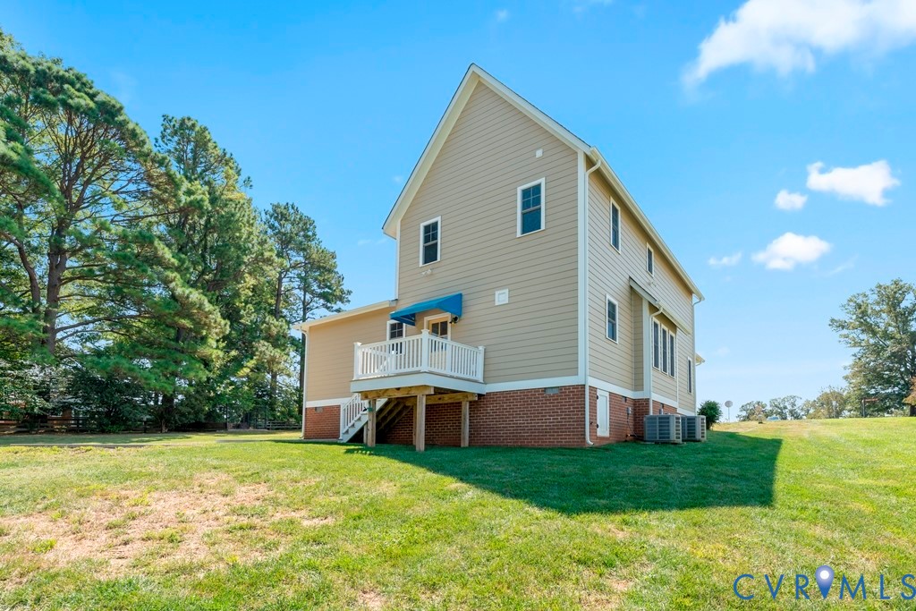 3029 Swanns Inn Crescent Goochland, VA 23063 - Photo 11 of 19 Rear view of property featuring a yard, a deck, an