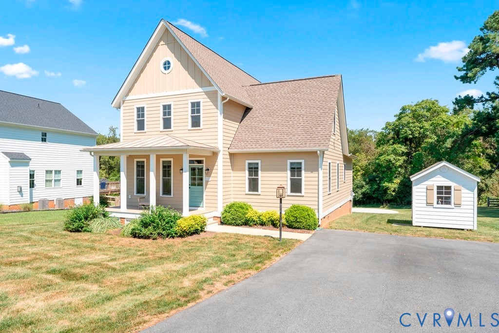 3029 Swanns Inn Crescent Goochland, VA 23063 - Photo 3 of 19 View of front of house with a front lawn, covered
