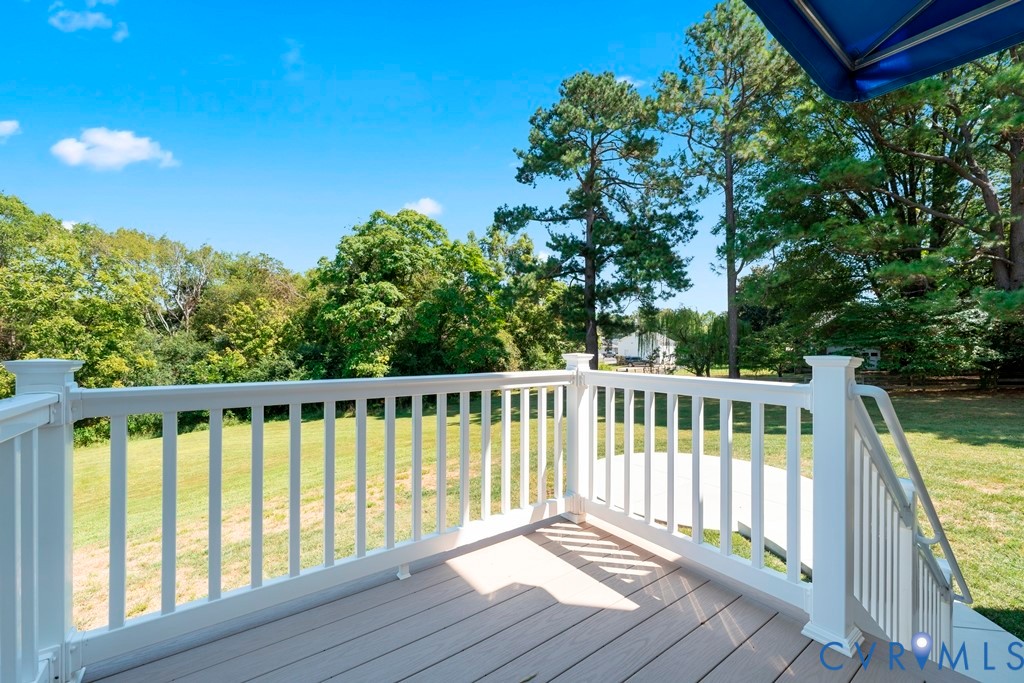 3029 Swanns Inn Crescent Goochland, VA 23063 - Photo 5 of 19 Deck featuring a lawn and view of wooded area
