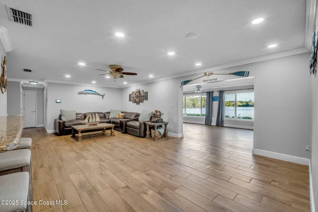 a view of a room with gym equipment and a large window