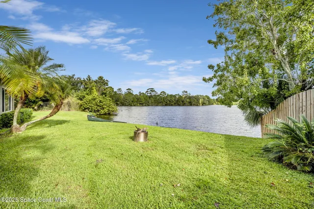 a view of a lake with a yard