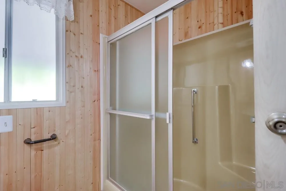 18218 Paradise Mountain Road, Unit 129 Valley Center, CA 92082 - Photo 21 of 58 a bathroom with a shower