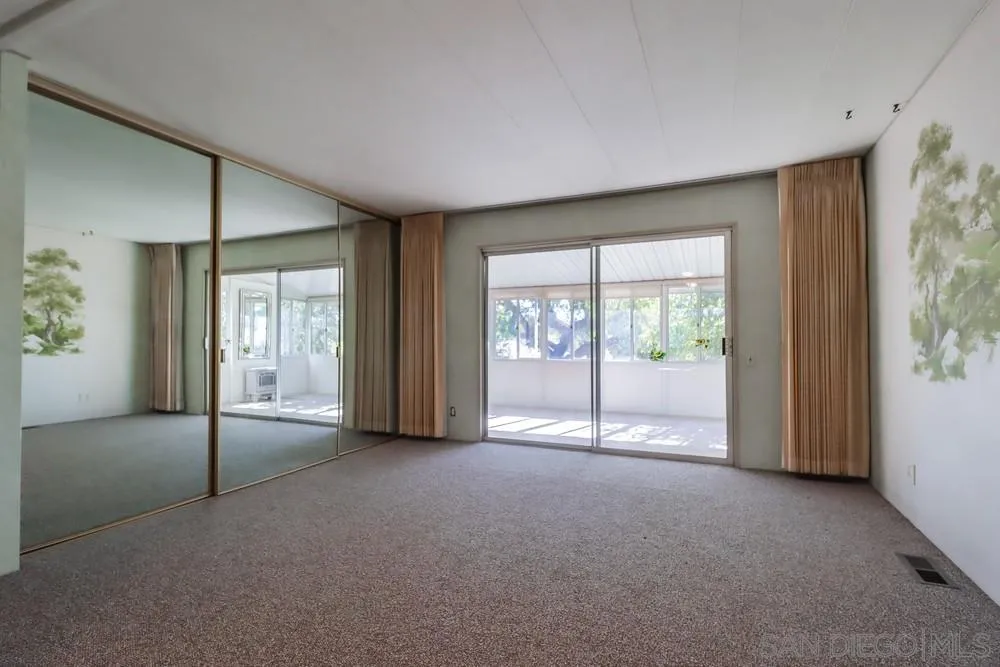 18218 Paradise Mountain Road, Unit 129 Valley Center, CA 92082 - Photo 26 of 58 a view of an empty room with a window