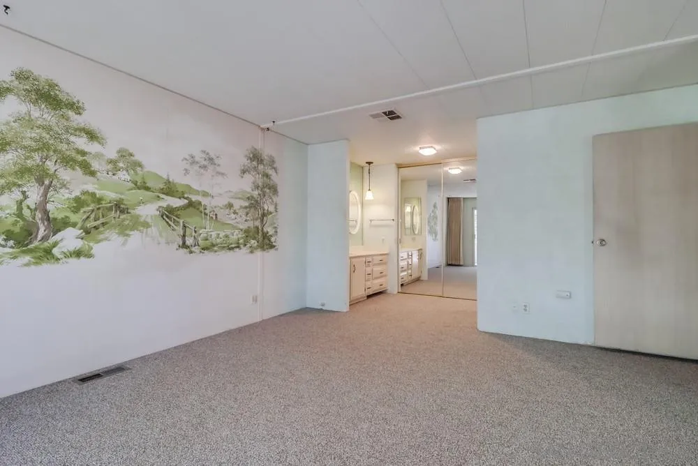 18218 Paradise Mountain Road, Unit 129 Valley Center, CA 92082 - Photo 27 of 58 a view of a big room with windows and chandelier fan