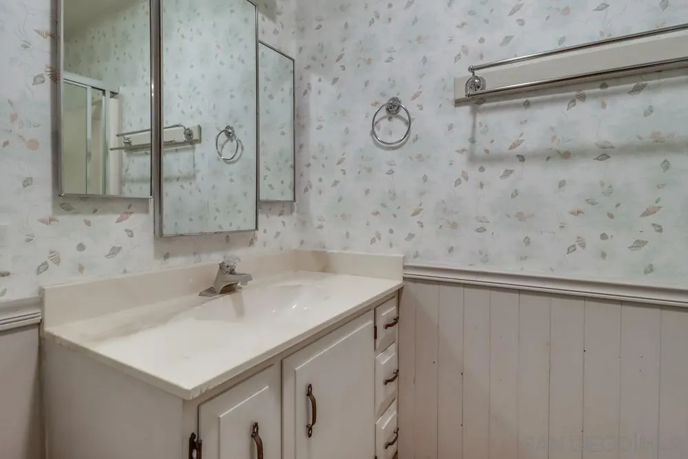18218 Paradise Mountain Road, Unit 129 Valley Center, CA 92082 - Photo 30 of 58 a bathroom with a sink and a mirror