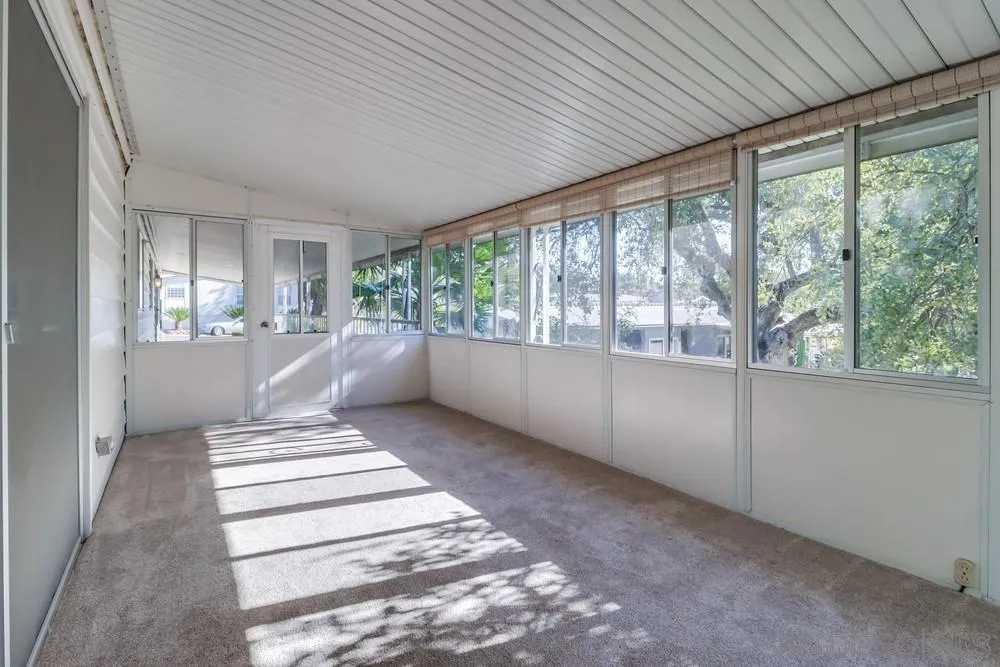 18218 Paradise Mountain Road, Unit 129 Valley Center, CA 92082 - Photo 32 of 58 a view of an empty room with a window