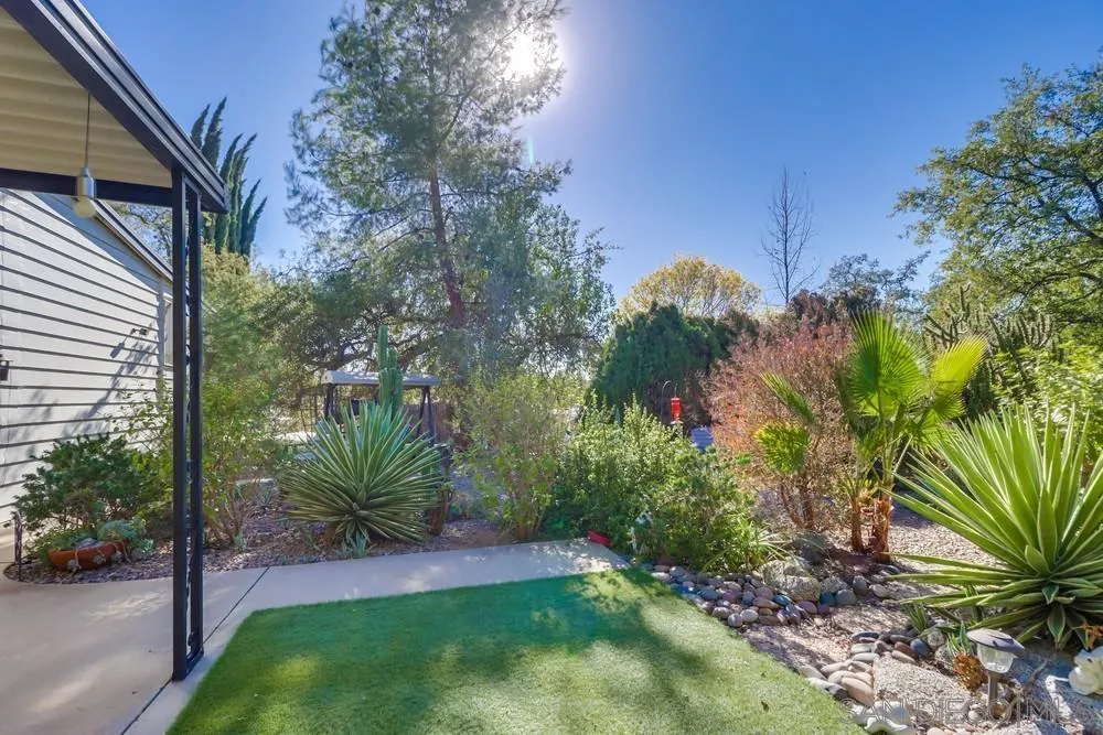 18218 Paradise Mountain Road, Unit 129 Valley Center, CA 92082 - Photo 47 of 58 a view of a backyard with a garden