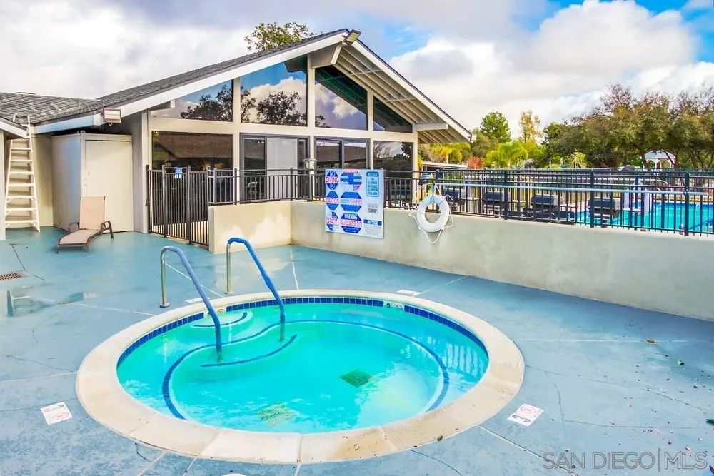 18218 Paradise Mountain Road, Unit 129 Valley Center, CA 92082 - Photo 51 of 58 a view of a house with swimming pool