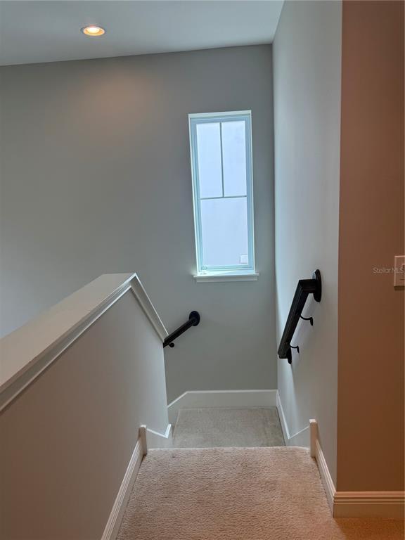 7241 Sunny Meadow Windermere, FL 34786 - Photo 11 of 14 a view of staircase with white walls
