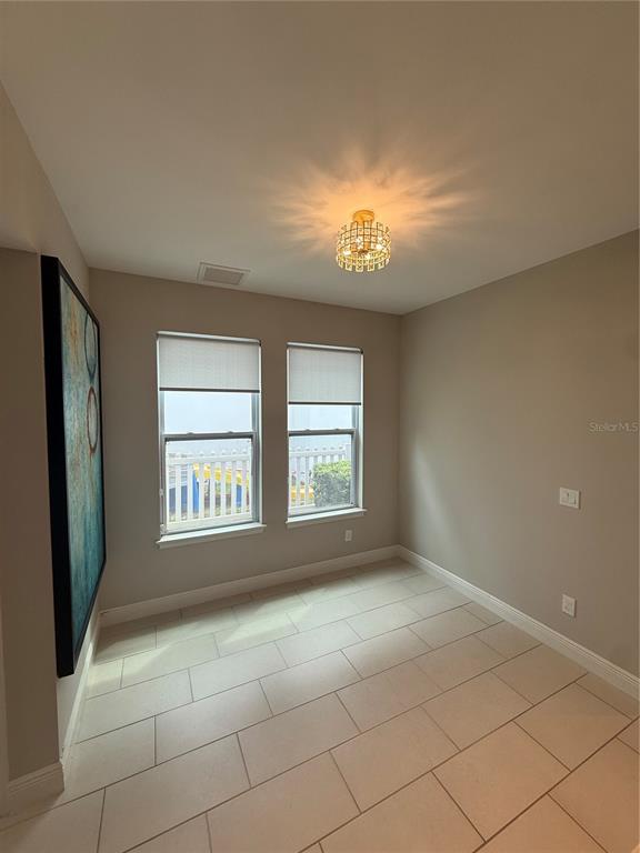 7241 Sunny Meadow Windermere, FL 34786 - Photo 4 of 14 a view of an empty room with a window