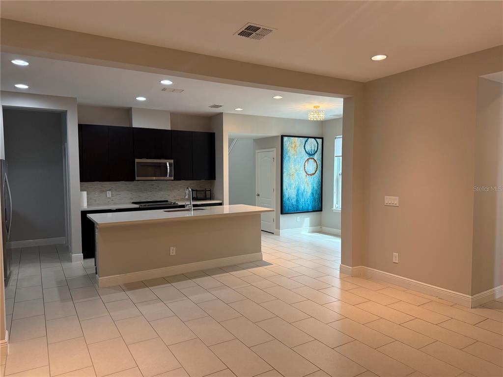 7241 Sunny Meadow Windermere, FL 34786 - Photo 6 of 14 a large bathroom with a large mirror vanity and a sink