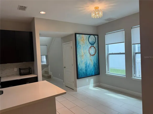 a view of an entryway with wooden floor