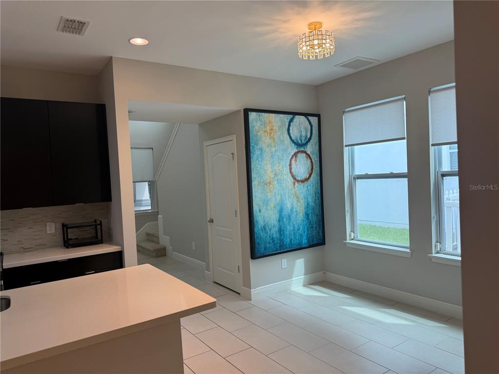 7241 Sunny Meadow Windermere, FL 34786 - Photo 9 of 14 a view of an entryway with wooden floor