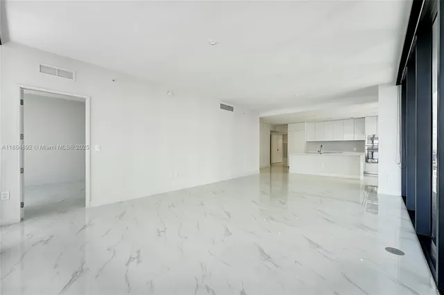 a living room with furniture flowerpot and a potted plant