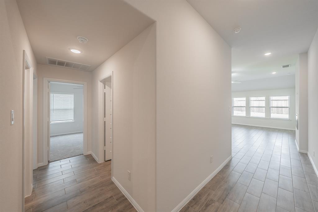 2727 Rambling Road Celina, TX 75009 - Photo 11 of 40 a view of hallway with wooden floor