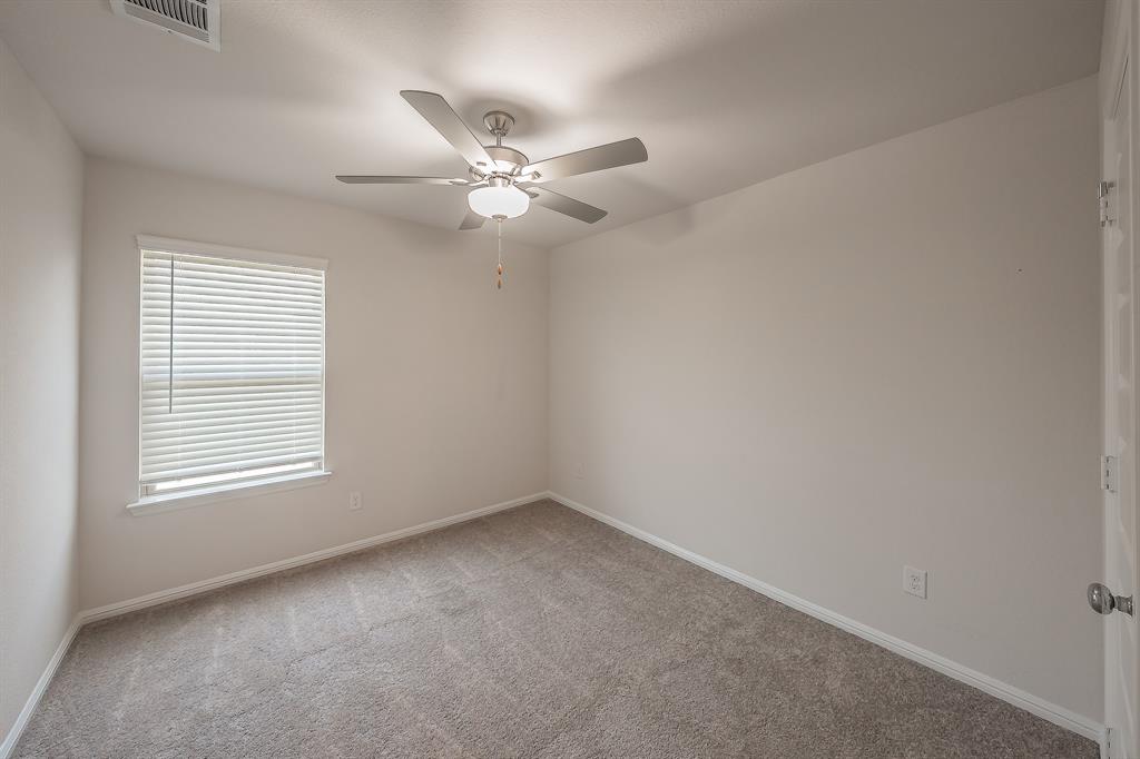 2727 Rambling Road Celina, TX 75009 - Photo 16 of 40 an empty room with a window and ceiling fan
