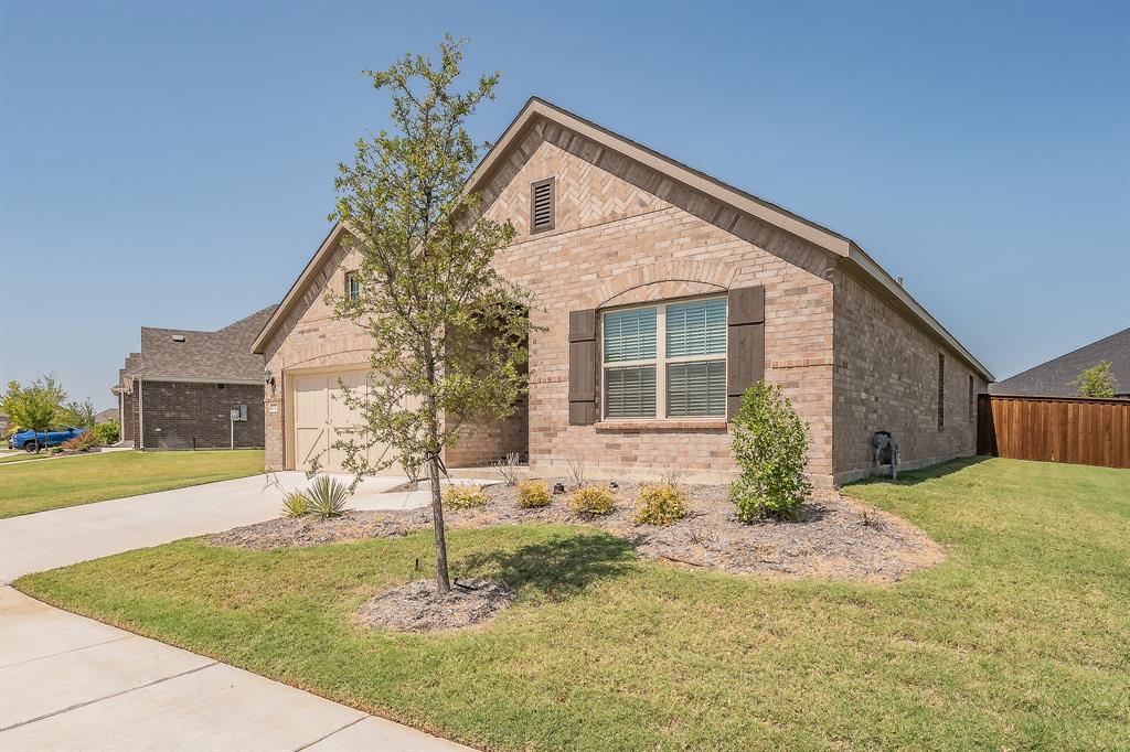2727 Rambling Road Celina, TX 75009 - Photo 3 of 40 a front view of a house with garden