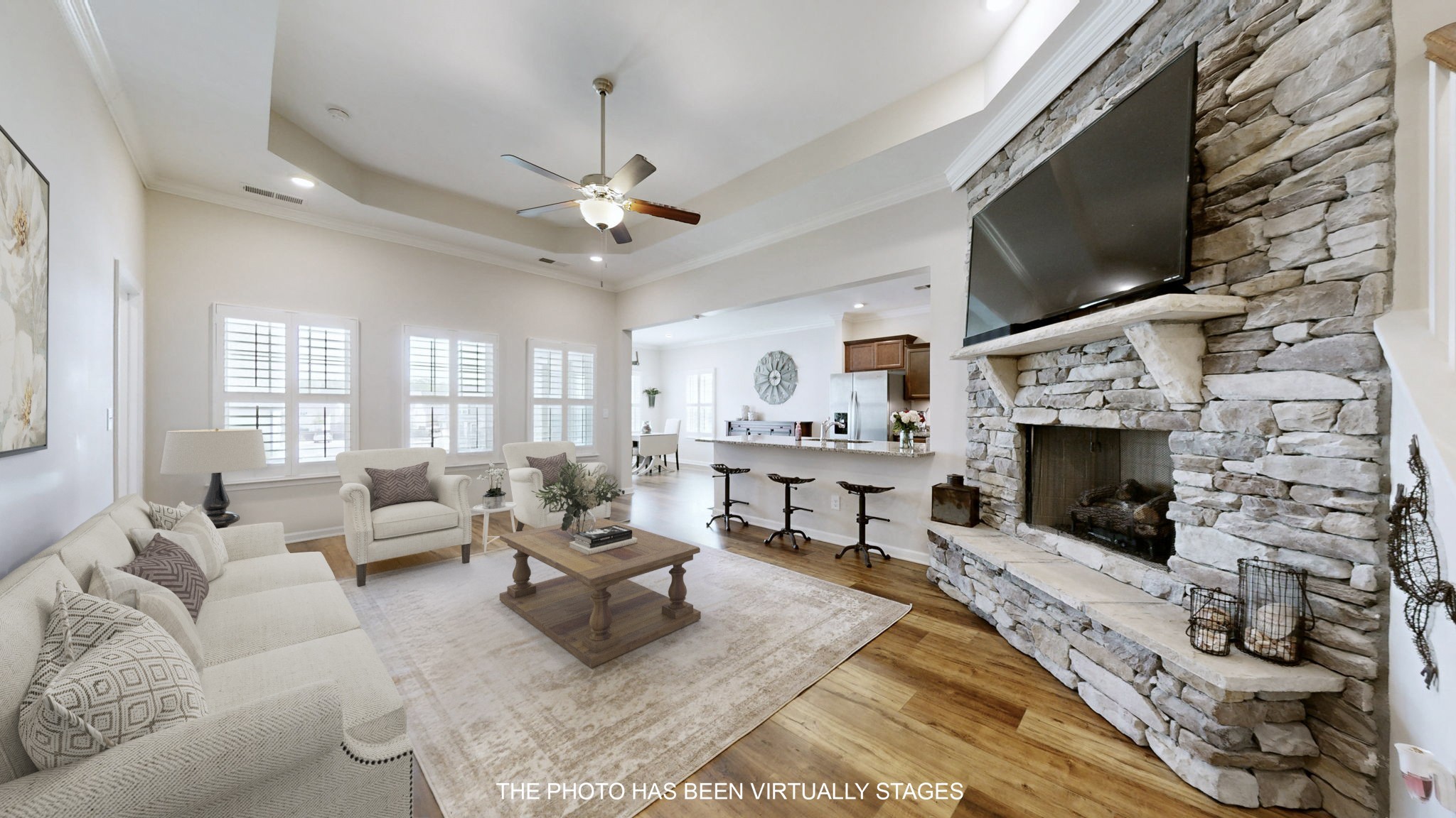 1047 Brayden Drive Fairview, TN 37062 - Photo 3 of 31 a living room with furniture a flat screen tv and a fireplace