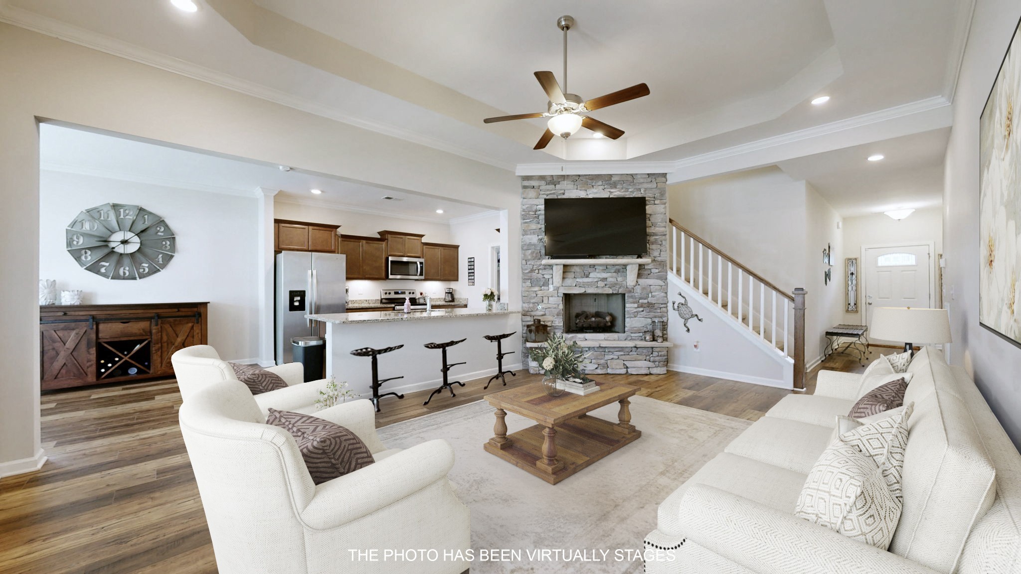 1047 Brayden Drive Fairview, TN 37062 - Photo 4 of 31 a living room with furniture a fireplace and a flat screen tv