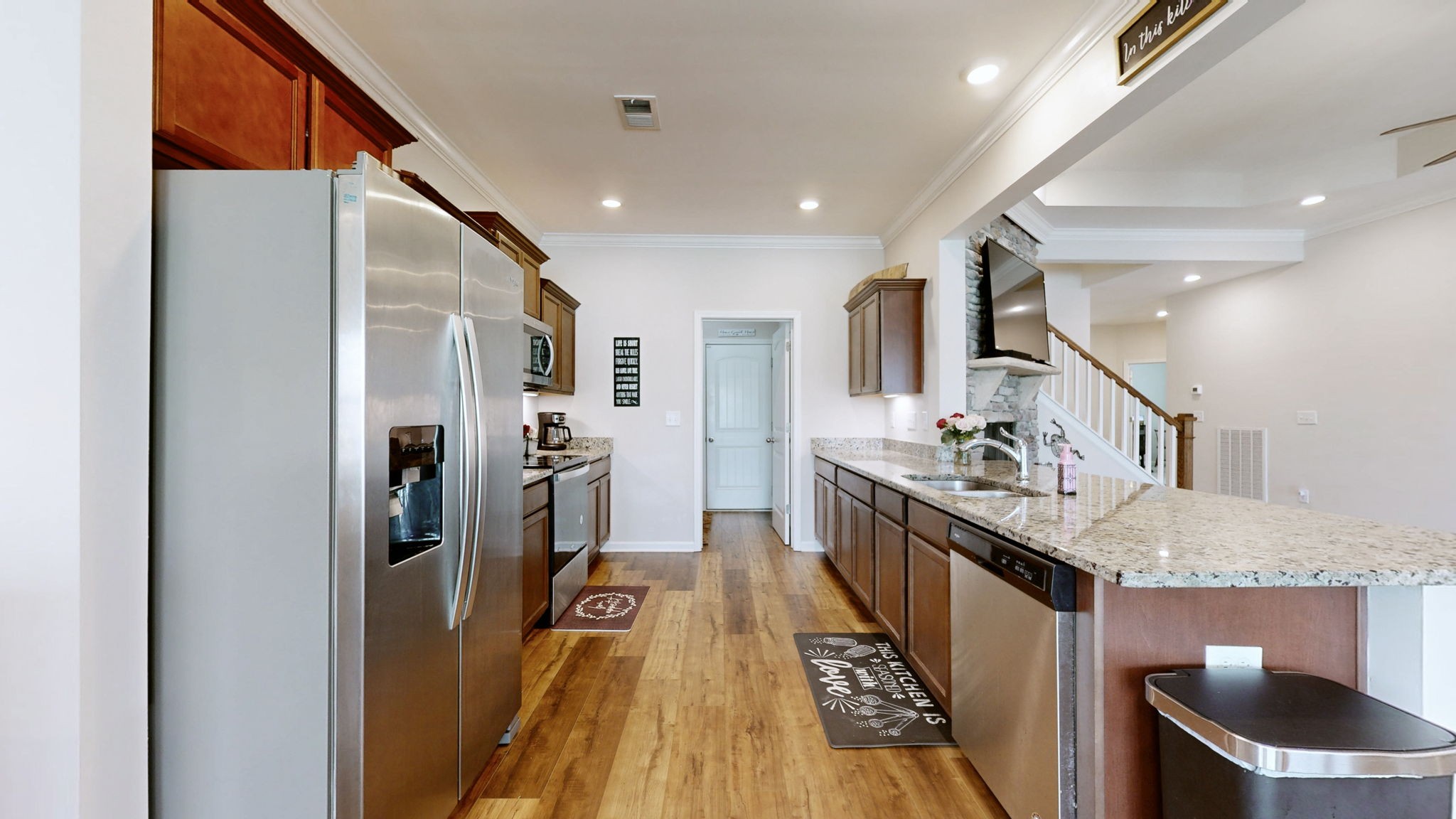 1047 Brayden Drive Fairview, TN 37062 - Photo 6 of 31 a kitchen with stainless steel appliances granite countertop a refrigerator a stove and a sink
