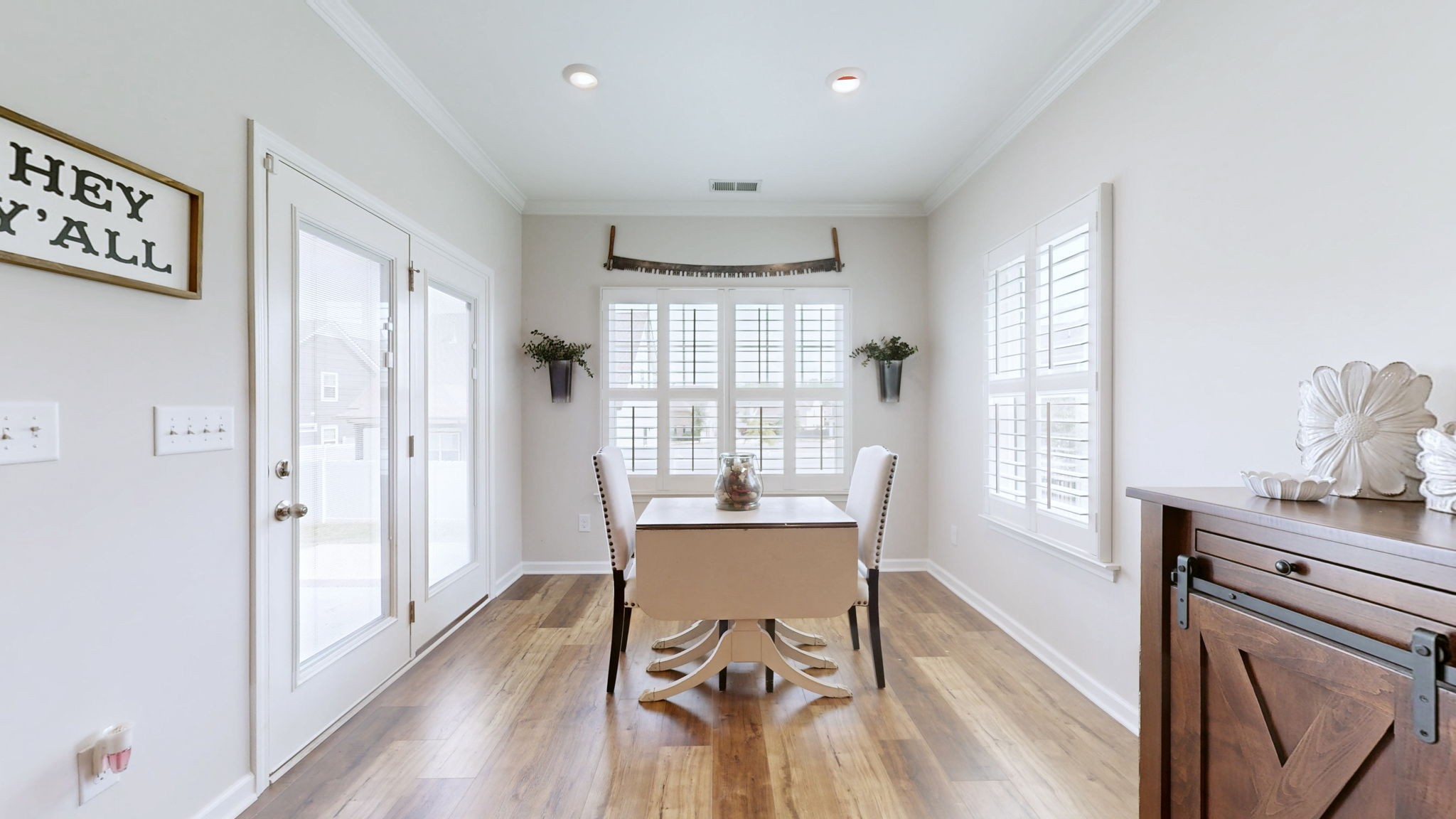 1047 Brayden Drive Fairview, TN 37062 - Photo 9 of 31 a view of a dining room with furniture window and wooden floor