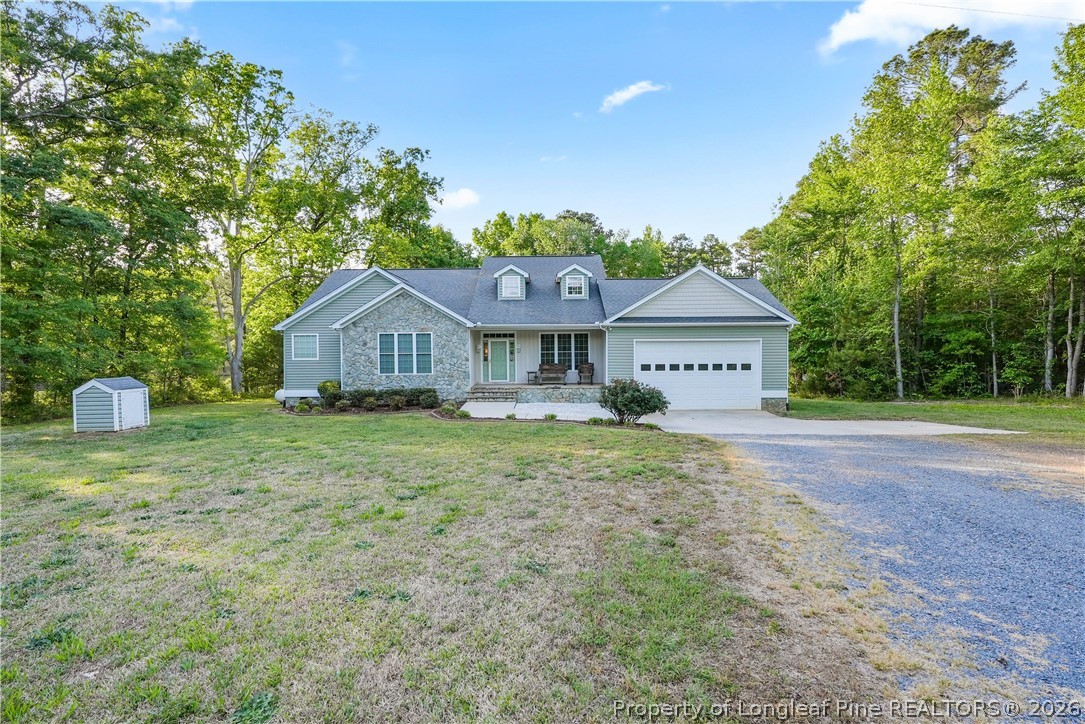 280 Hemp St Extension Robbins, NC 27325 - Photo 2 of 29 a front view of a house with a yard and green space