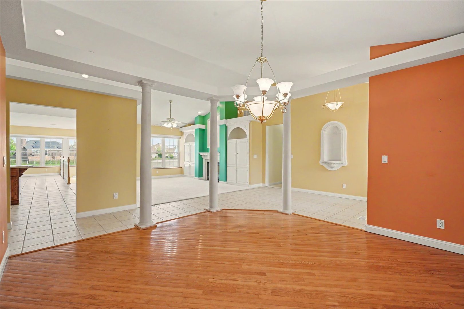 2910 Rutherford Drive Urbana, IL 61802 - Photo 15 of 62 a view of an empty room with wooden floor and a kitchen