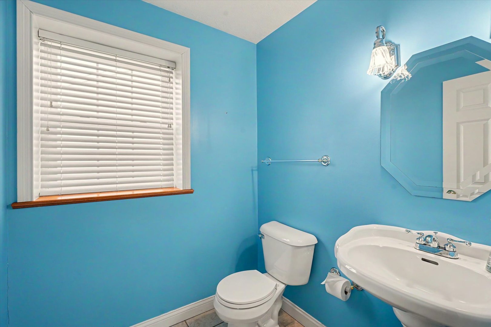 2910 Rutherford Drive Urbana, IL 61802 - Photo 31 of 62 a bathroom with a toilet a sink and a window