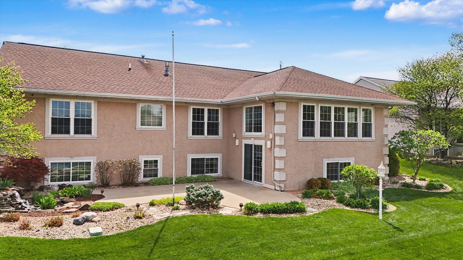 2910 Rutherford Drive Urbana, IL 61802 - Photo 56 of 62 a view of a house with a yard patio and a garden