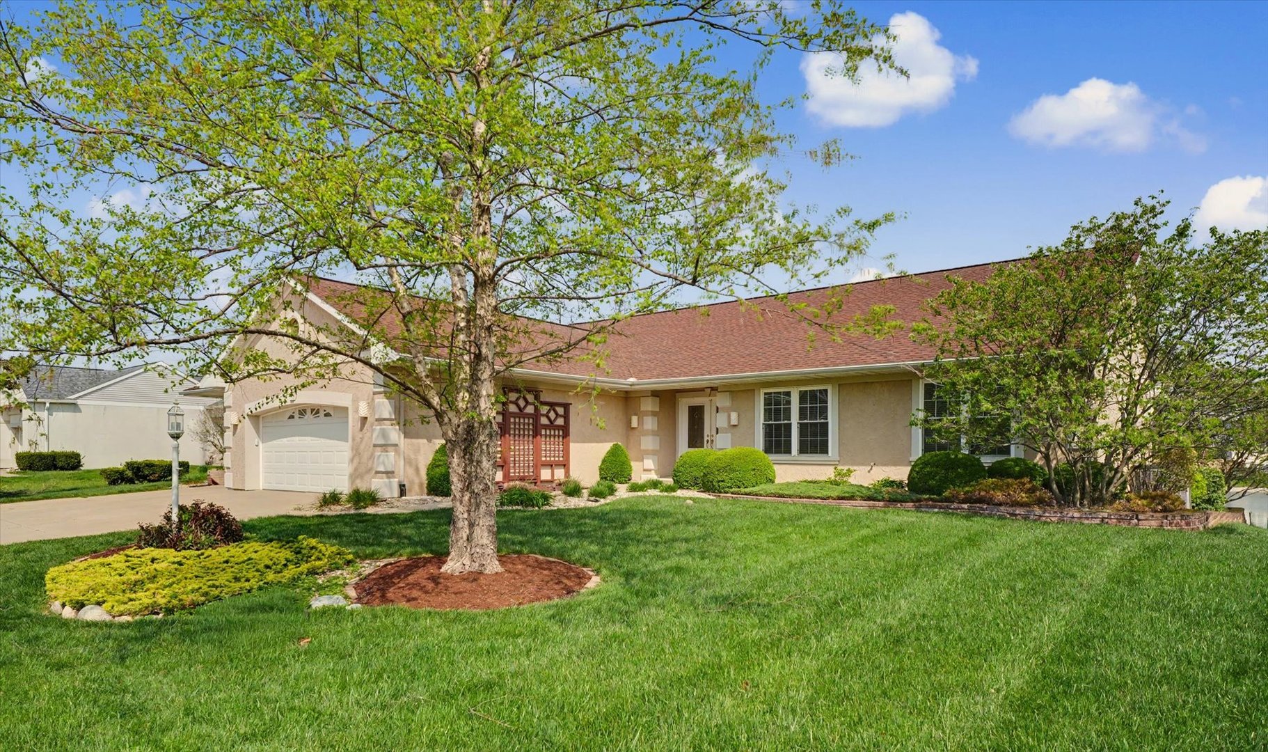 2910 Rutherford Drive Urbana, IL 61802 - Photo 6 of 62 a front view of a house with a garden