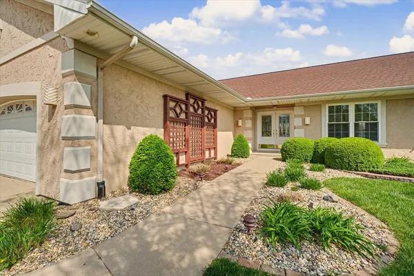 a front view of a house with garden