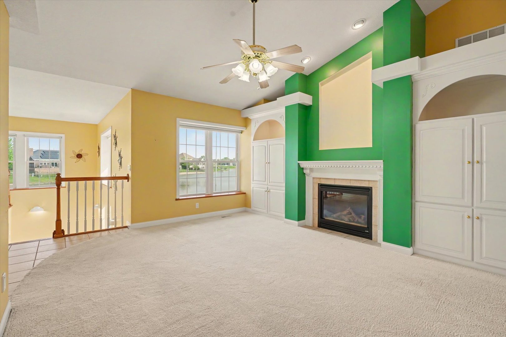 2910 Rutherford Drive Urbana, IL 61802 - Photo 9 of 62 a view of an empty room with a fireplace and a window