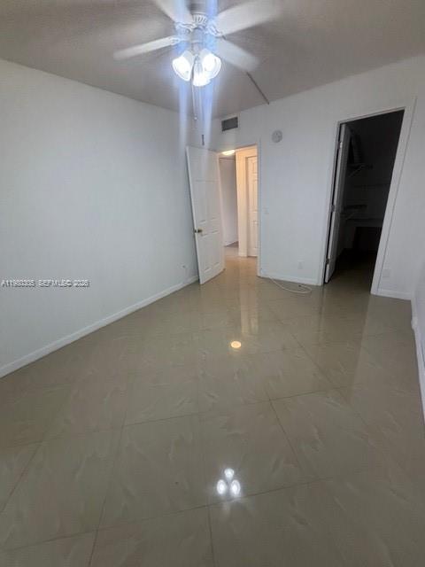305 Preston F, Unit H Boca Raton, FL 33434 - Photo 5 of 17 wooden floor in an empty room with a window