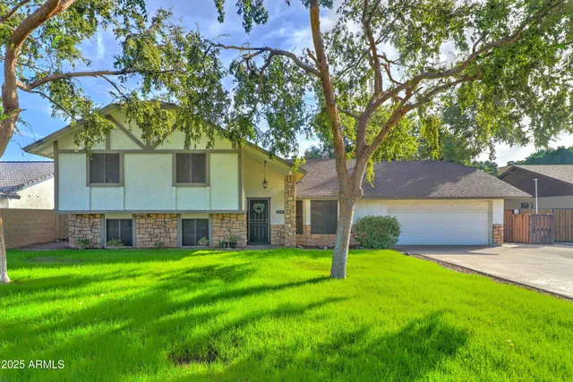 front view of a house with a yard