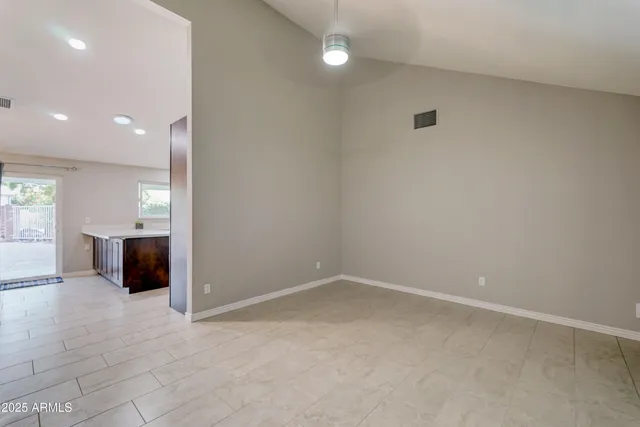 an empty room with a bathroom