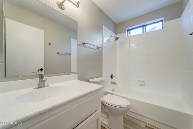 a bathroom with a sink a toilet and a bathtub