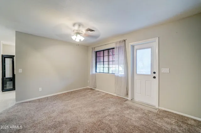 a view of an empty room with a window
