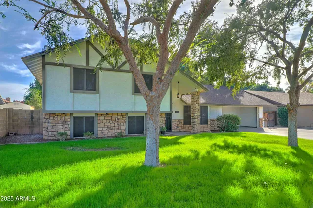 front view of a house with a yard