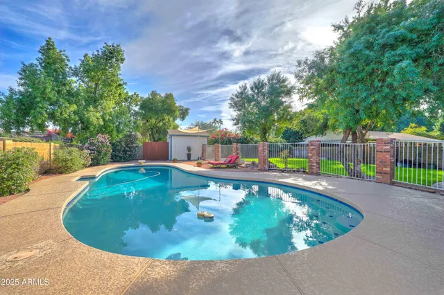 a view of a swimming pool with a balcony