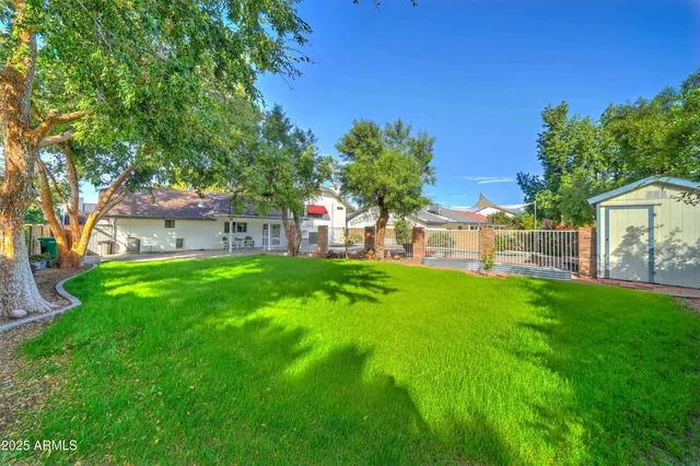a view of a house with a back yard
