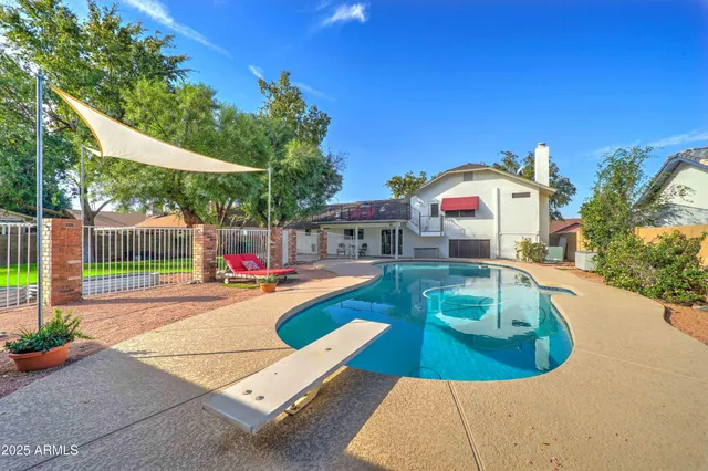 a view of a swimming pool with a patio