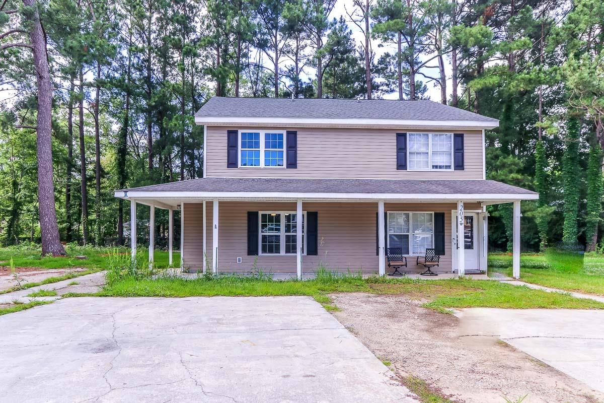 205 Plantation Road Myrtle Beach, SC 29588 - Photo 1 of 35 Farmhouse-style home featuring covered porch