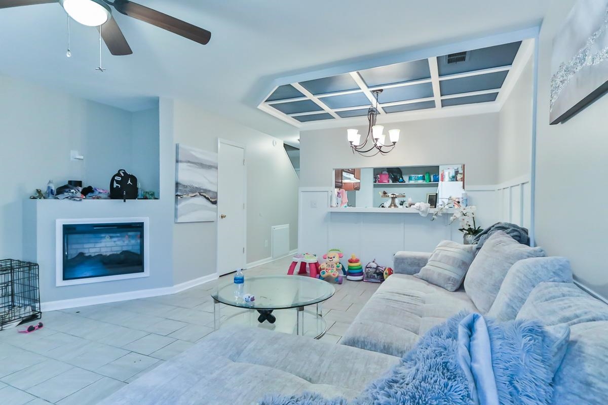 205 Plantation Road Myrtle Beach, SC 29588 - Photo 18 of 35 Living room with tile floors and ceiling fan with