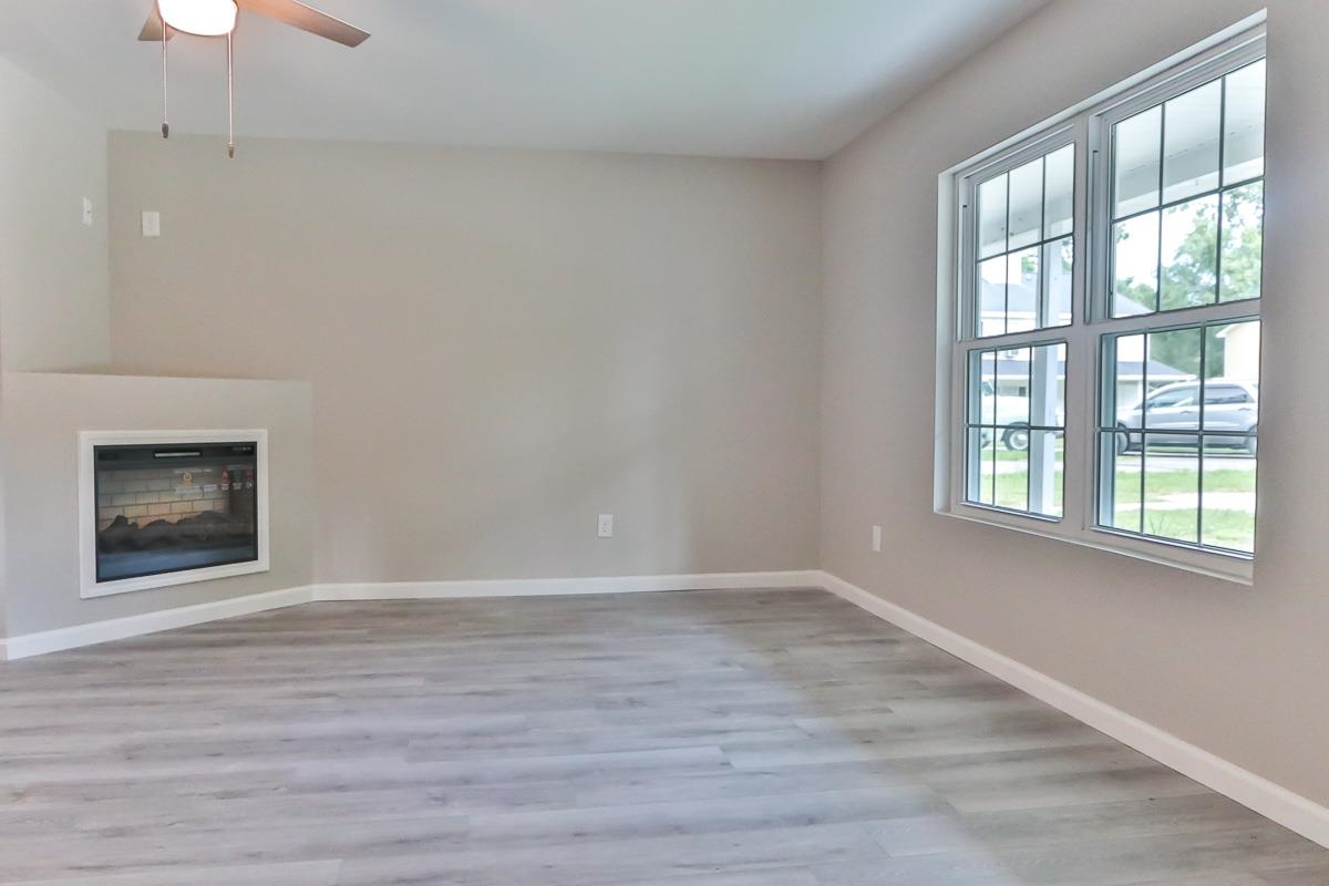 205 Plantation Road Myrtle Beach, SC 29588 - Photo 2 of 35 Unfurnished living room with wood-type flooring an