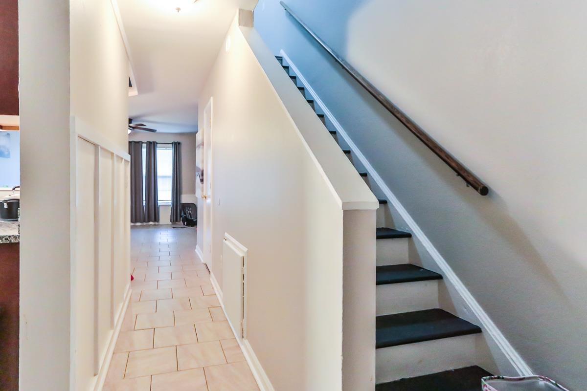 205 Plantation Road Myrtle Beach, SC 29588 - Photo 21 of 35 Staircase featuring ceiling fan and light tile flo